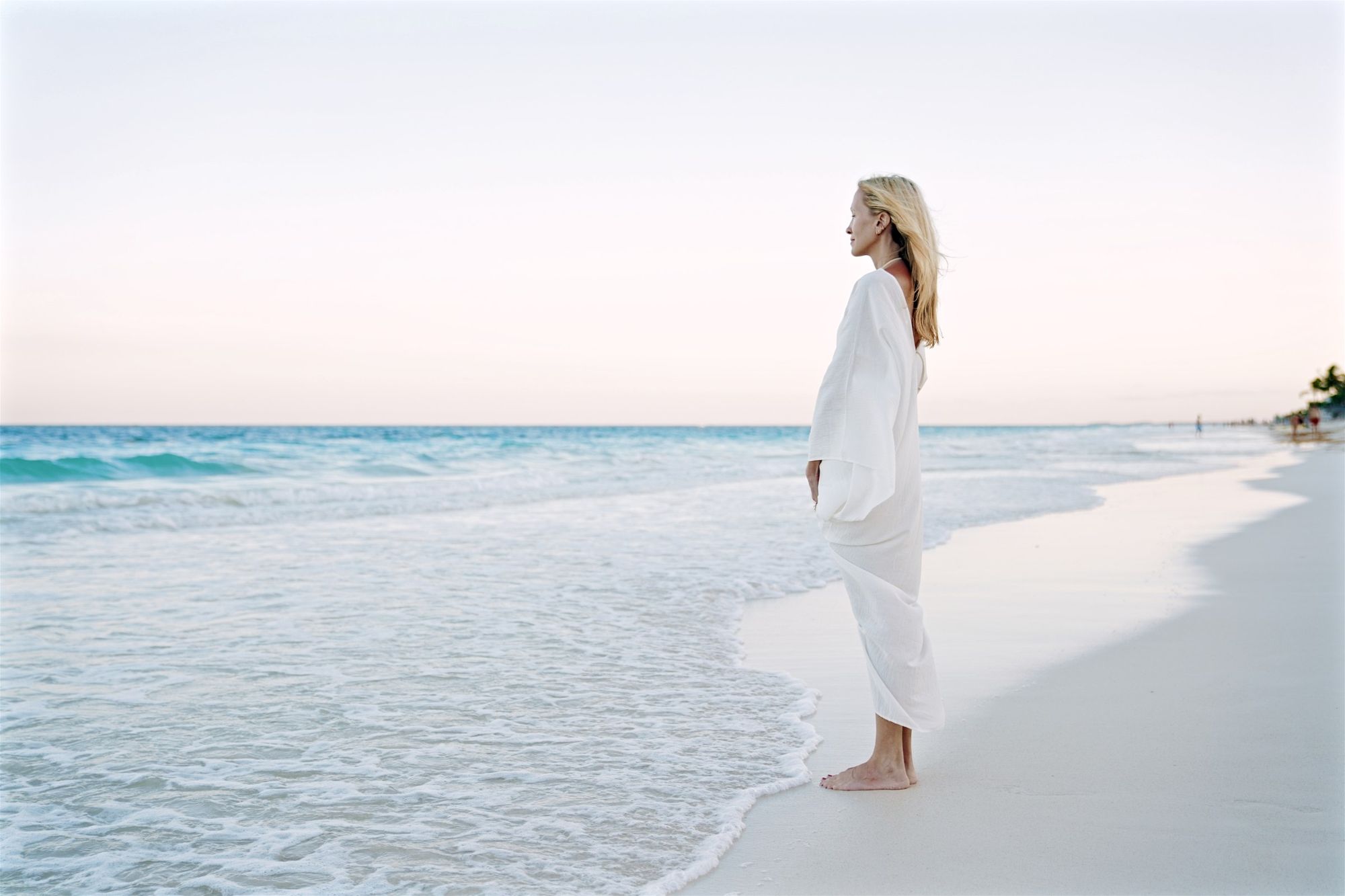 Daniella Hunter on the shore at Tulum, looking out to sea