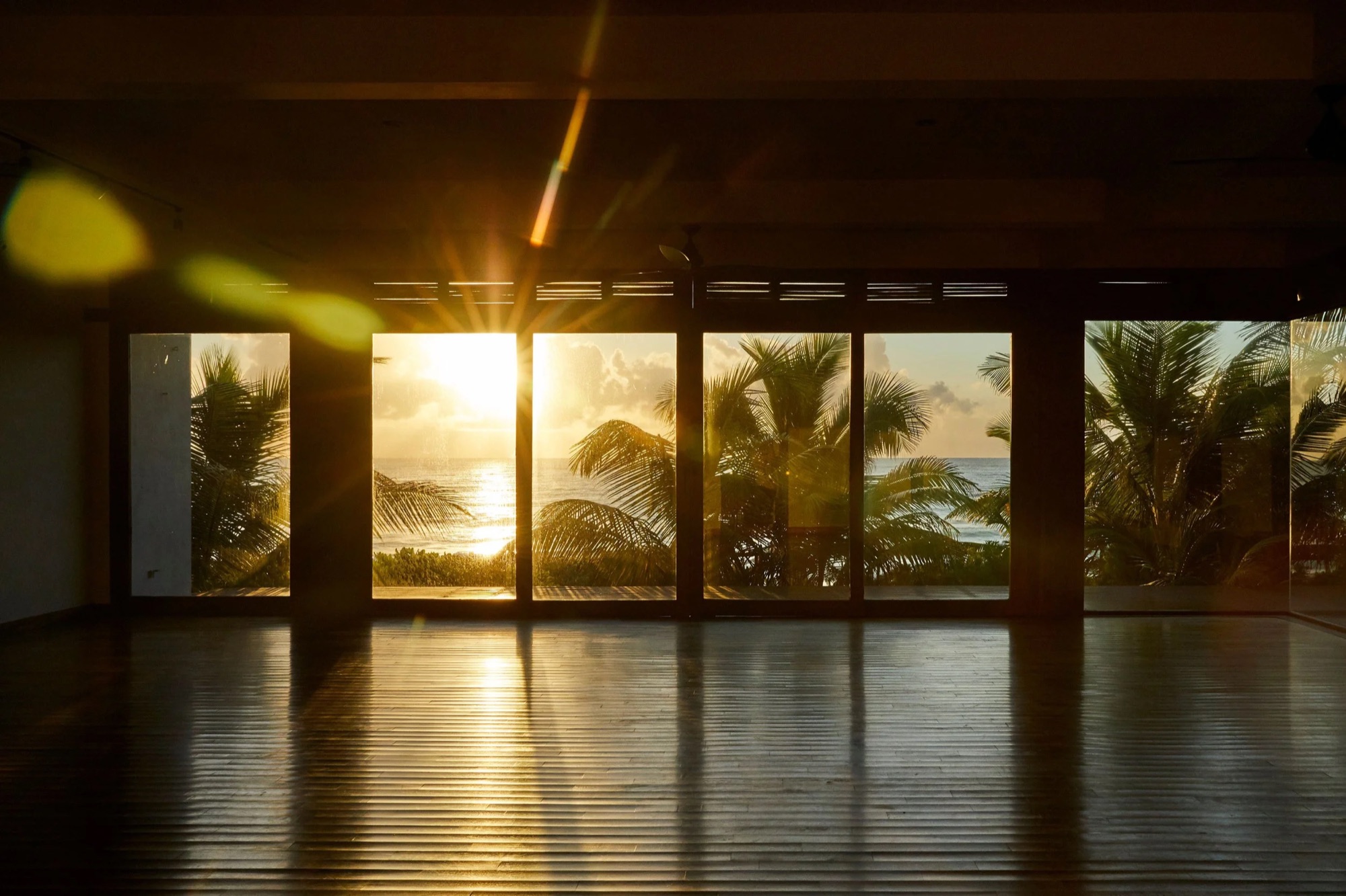 The Sanará shala at sunrise, doors open to the sea