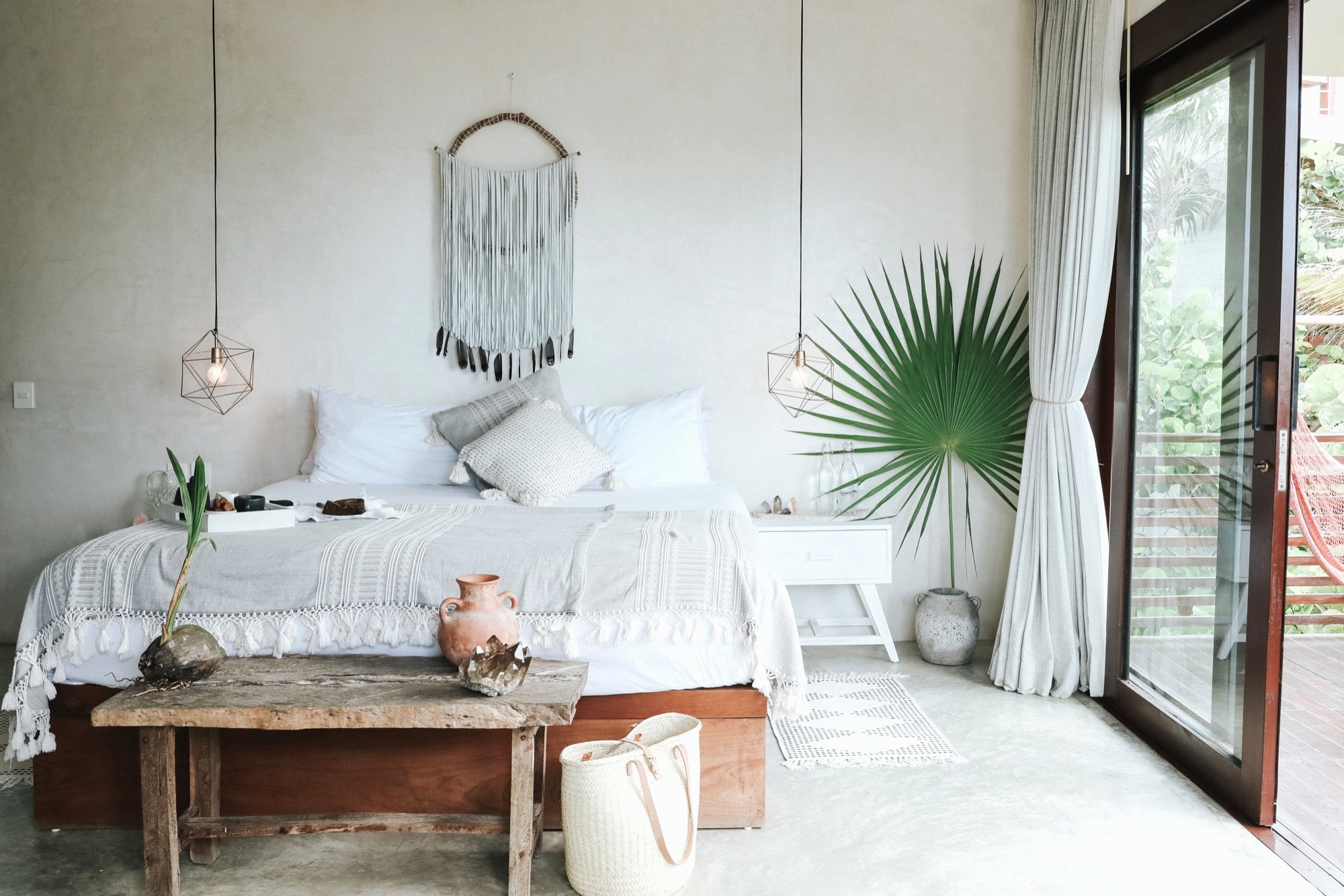 A Sanará bedroom, the balcony beyond